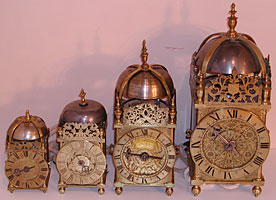 group of four clocks of different sizes