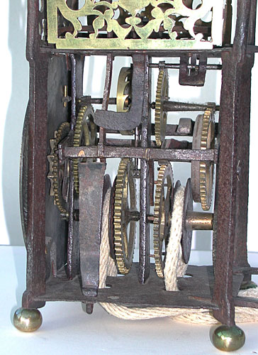 primitive lantern clock with iron frame dating from the early seventeenth century
