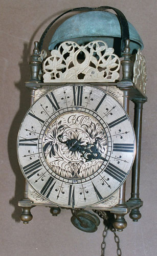 A newly-discovered lantern clock in its original oak standing case of a particularly distinctive type, dating from the late 1680s, signed simply by monogram BH